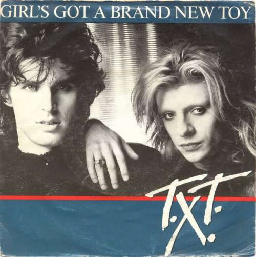 Cover T.X.T. - Girl's Got A Brand New Toy (7, Single) Schallplatten Ankauf