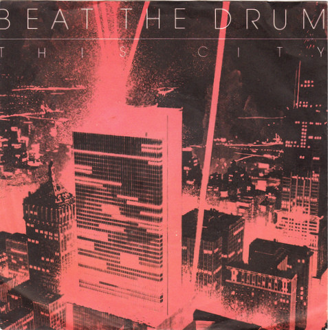 Cover Beat The Drum - This City (7, Single) Schallplatten Ankauf