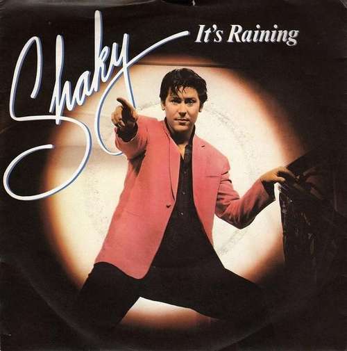 Cover Shakin' Stevens - It's Raining (7, Single, Pap) Schallplatten Ankauf