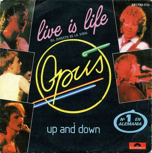 Cover Opus - Live Is Life = El Directo Es La Vida (7, Single) Schallplatten Ankauf
