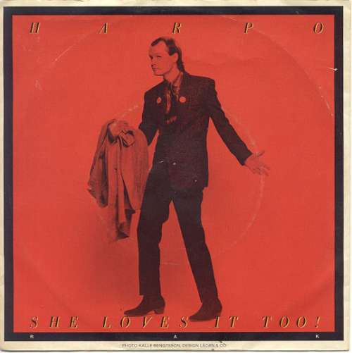Cover Harpo - She Loves It Too! (7, Single) Schallplatten Ankauf