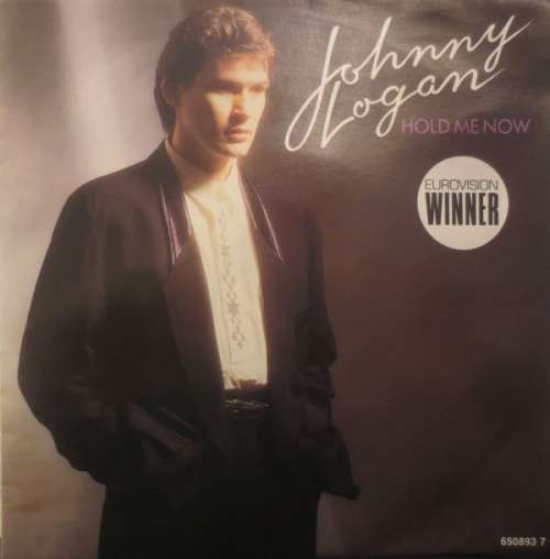 Cover Johnny Logan - Hold Me Now (7, Single) Schallplatten Ankauf