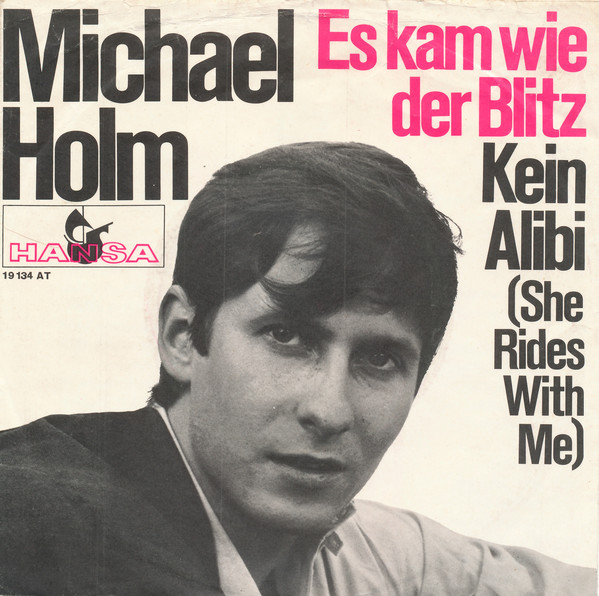 Cover Michael Holm - Es Kam Wie Der Blitz / Kein Alibi (She Rides With Me) (7, Single) Schallplatten Ankauf