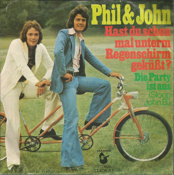 Cover Phil & John - Hast Du Schon Mal Unterm Regenschirm Geküßt? (7, Single) Schallplatten Ankauf