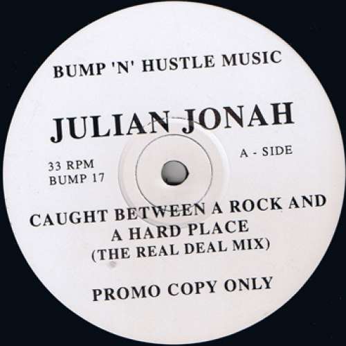 Cover Julian Jonah - Caught Between A Rock And A Hard Place (12, Promo) Schallplatten Ankauf