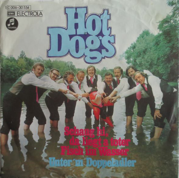 Cover Hot Dogs - Schaug Hi, Da Liegt A Toter Fisch Im Wasser / Unter'm Doppeladler (7, Single) Schallplatten Ankauf