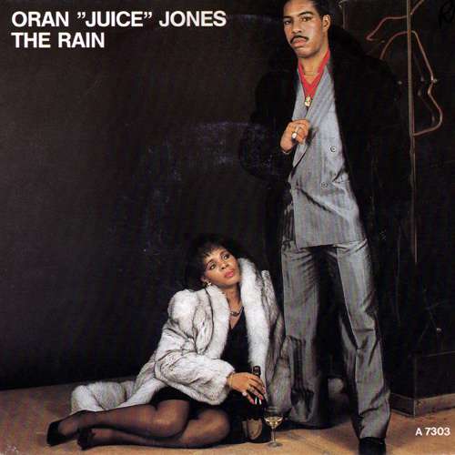 Cover Oran Juice Jones* - The Rain (7, Single) Schallplatten Ankauf