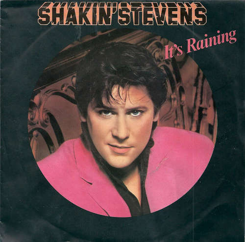 Cover Shakin' Stevens - It's Raining (7, Single) Schallplatten Ankauf